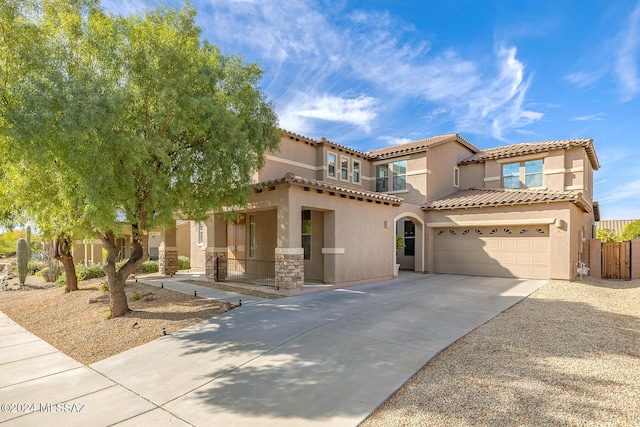 mediterranean / spanish-style house featuring a garage