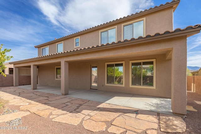 rear view of house featuring a patio area