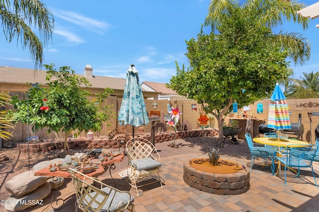 view of patio / terrace with a fire pit