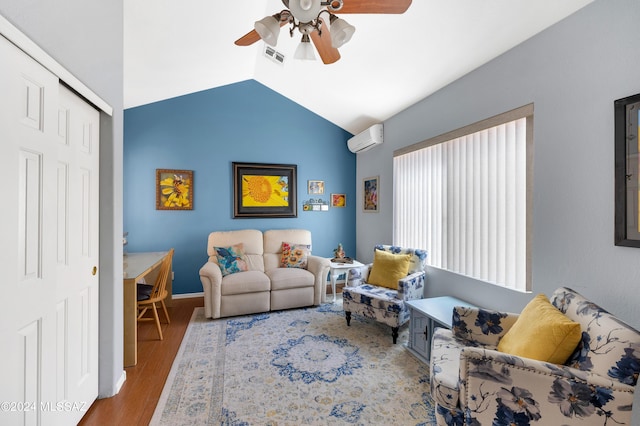 living room with hardwood / wood-style floors, vaulted ceiling, a wall unit AC, and ceiling fan