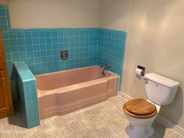 bathroom with tile patterned floors, radiator, toilet, and a washtub