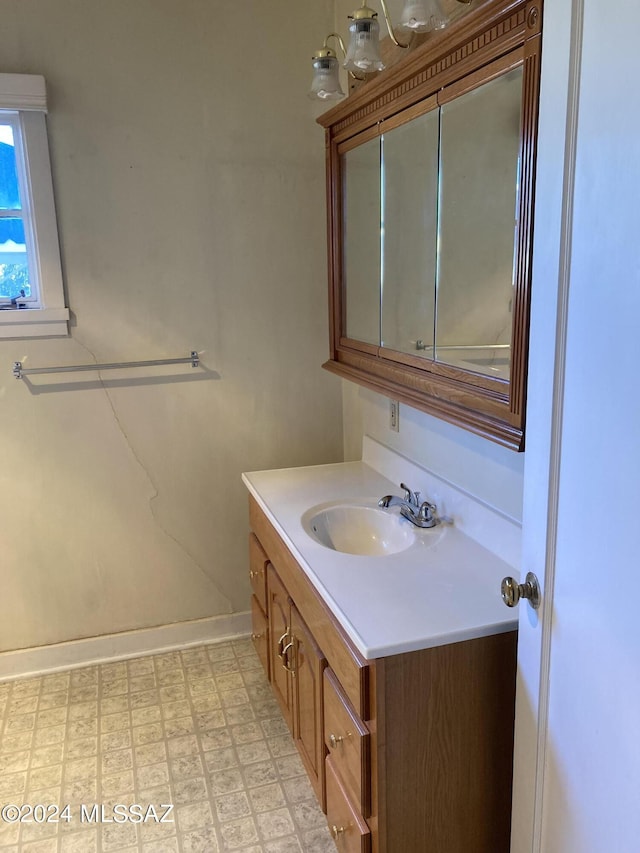 172 S Austin Blvd, Willcox, AZ 85643 - bathroom featuring baseboards, tile patterned floors, and vanity