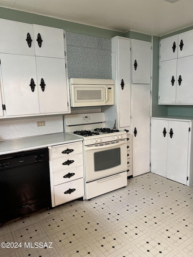 172 S Austin Blvd, Willcox, AZ 85643 - kitchen featuring white cabinets, light countertops, and white appliances