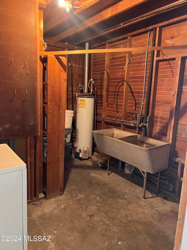 basement featuring sink and gas water heater