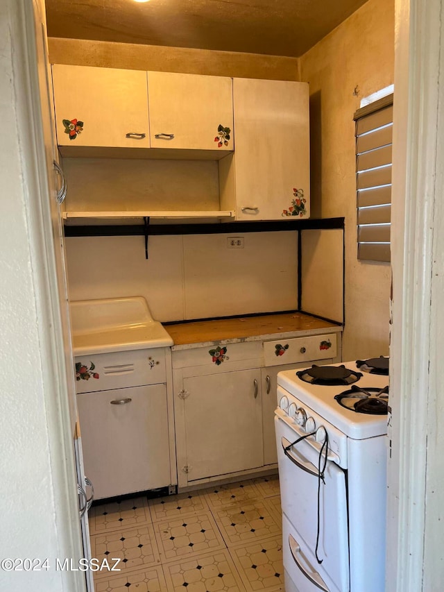 kitchen featuring white stove