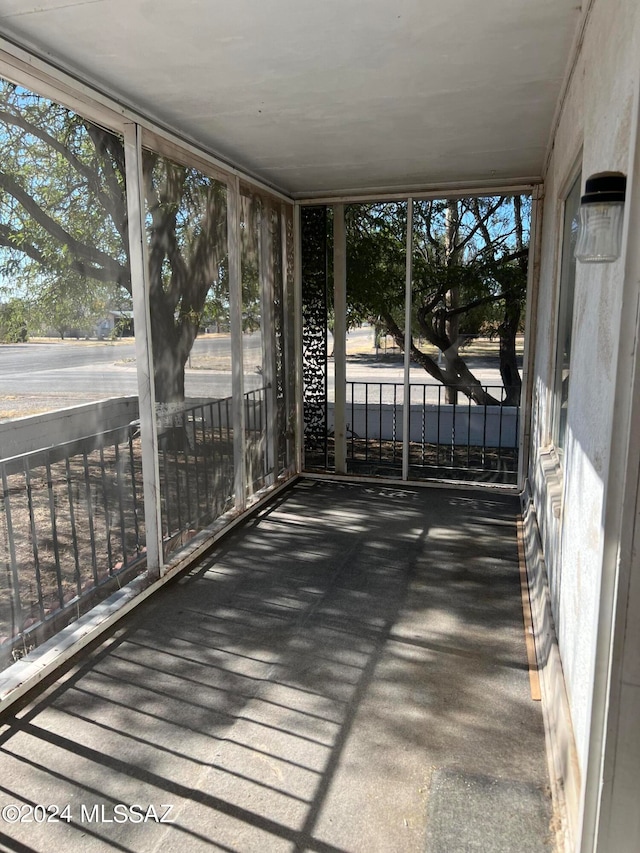 unfurnished sunroom with plenty of natural light