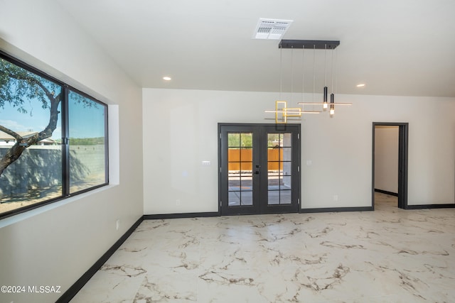 empty room featuring french doors