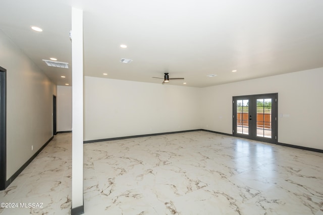 unfurnished room featuring french doors and ceiling fan