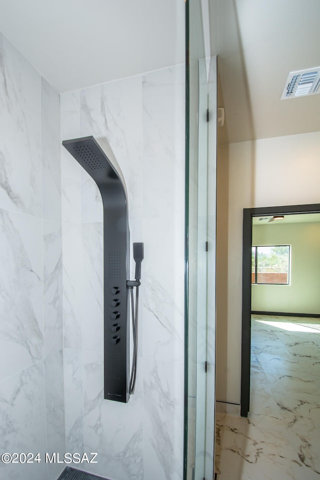 interior space featuring a tile shower