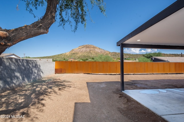 view of yard with a mountain view and a patio