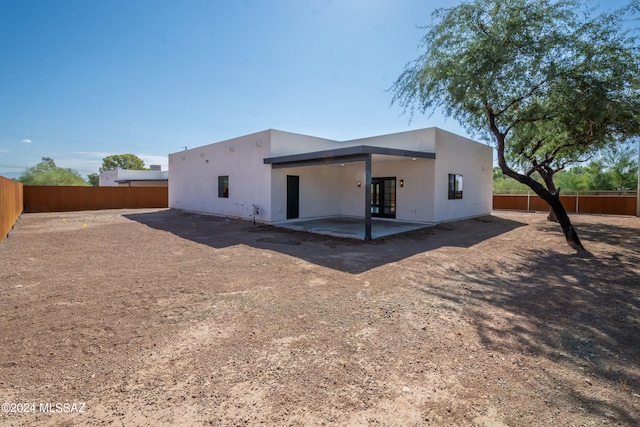rear view of property with a patio