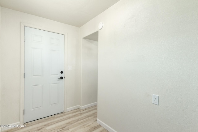 doorway to outside with light hardwood / wood-style flooring