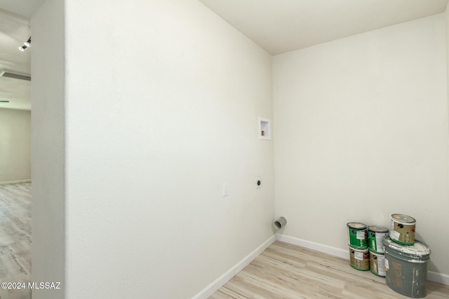 laundry room featuring washer hookup, hookup for an electric dryer, and light hardwood / wood-style floors