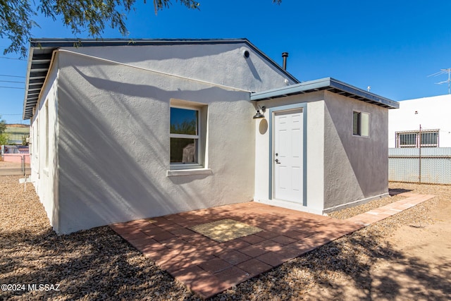 back of house with a patio