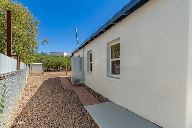 view of side of property with a patio