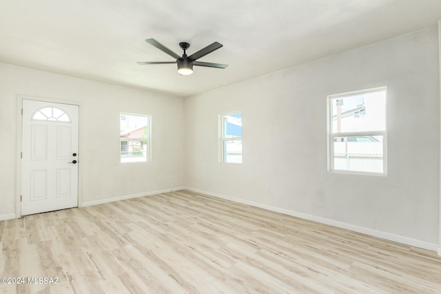 interior space featuring ceiling fan, plenty of natural light, and light hardwood / wood-style flooring