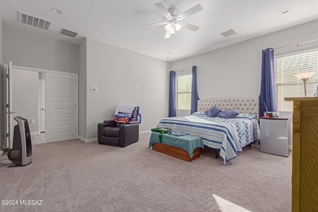 carpeted bedroom featuring ceiling fan