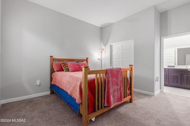 bedroom featuring carpet floors and ensuite bath