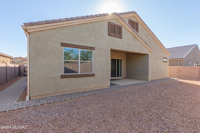 back of house featuring a patio