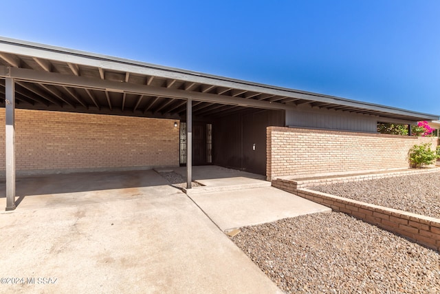 exterior space with a carport