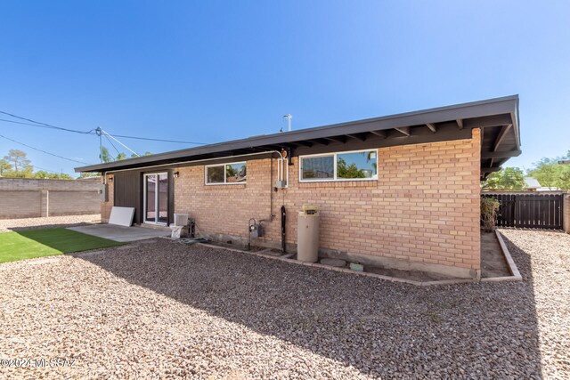 rear view of property featuring a patio