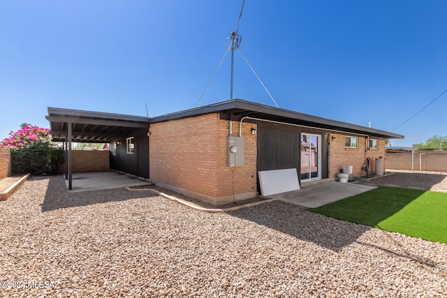 back of property featuring a patio area