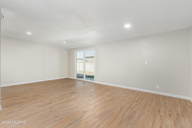 unfurnished room featuring light hardwood / wood-style flooring