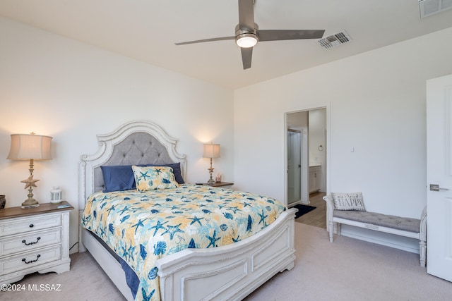 carpeted bedroom featuring connected bathroom and ceiling fan