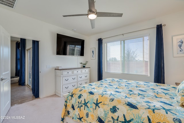 carpeted bedroom with ceiling fan