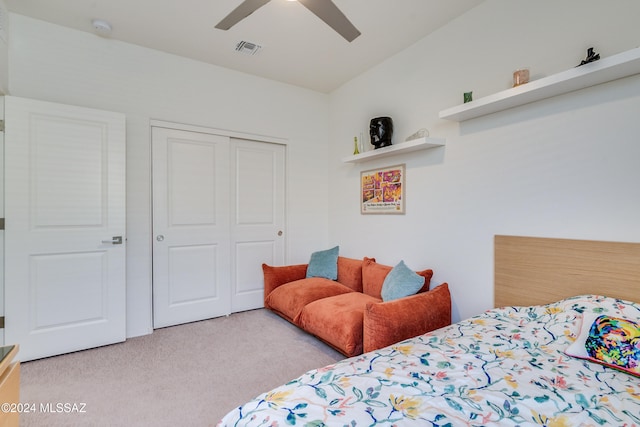 carpeted bedroom with a closet and ceiling fan