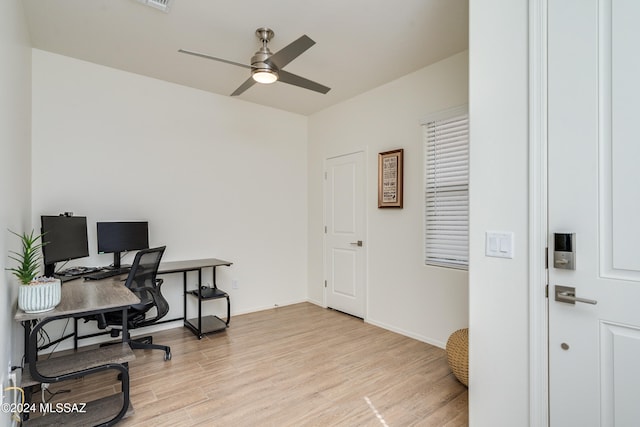 office space with light wood-type flooring and ceiling fan