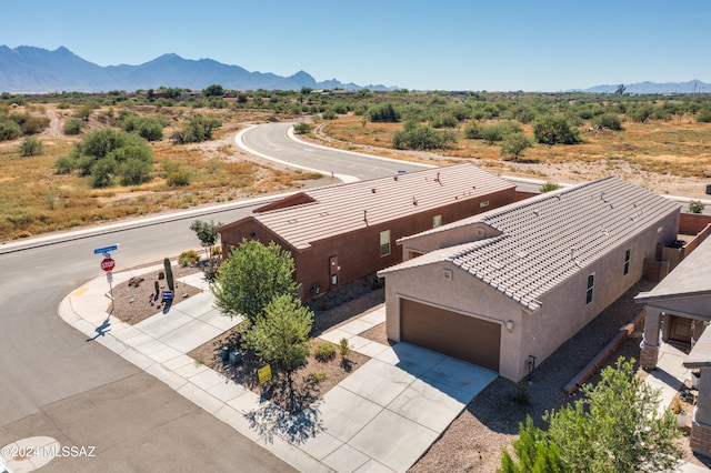 birds eye view of property with a mountain view