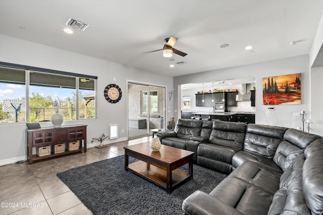 tiled living room featuring ceiling fan