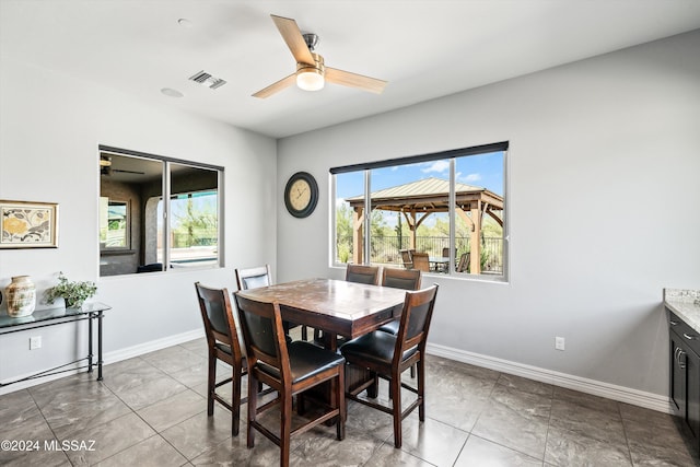 dining room featuring ceiling fan