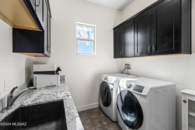 laundry room featuring sink, separate washer and dryer, and cabinets