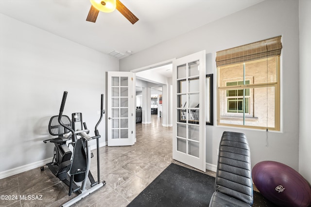 workout area featuring french doors and ceiling fan