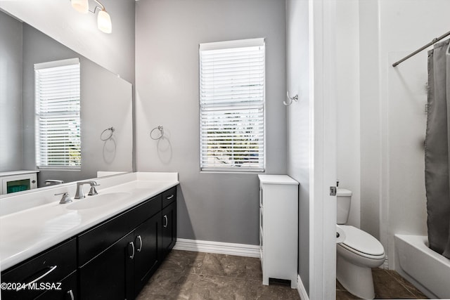 full bathroom with vanity, toilet, and shower / tub combo with curtain