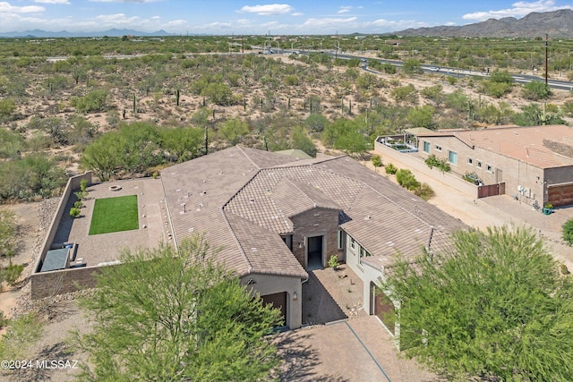 birds eye view of property featuring a mountain view