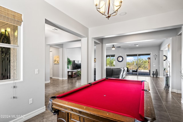 recreation room featuring pool table and ceiling fan with notable chandelier