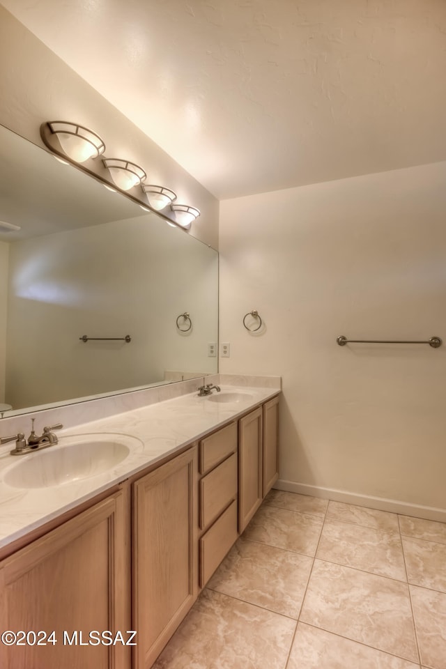 bathroom with vanity and tile patterned flooring