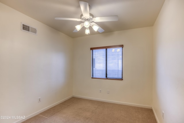 carpeted empty room with ceiling fan