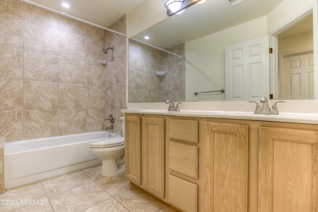 full bathroom featuring vanity, shower / tub combination, toilet, and tile patterned flooring