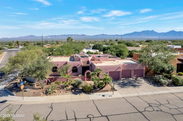 birds eye view of property featuring a mountain view