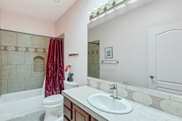 full bathroom with vanity, shower / bathtub combination with curtain, and toilet