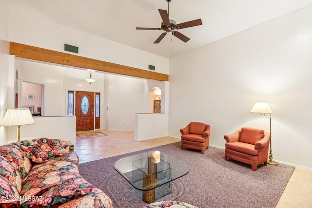 living room with light tile patterned floors and ceiling fan