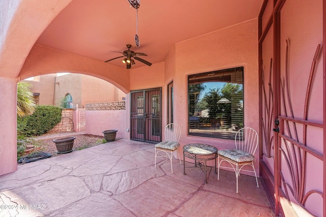 view of patio featuring ceiling fan