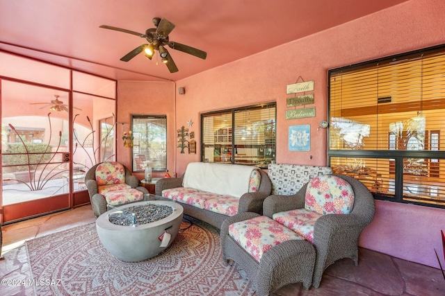 sunroom / solarium featuring ceiling fan