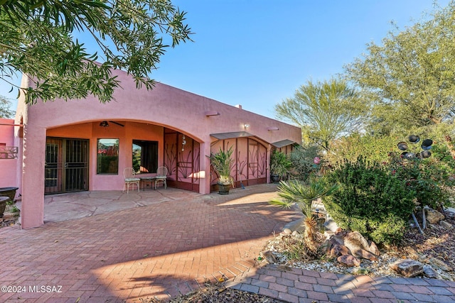 rear view of property featuring a patio area