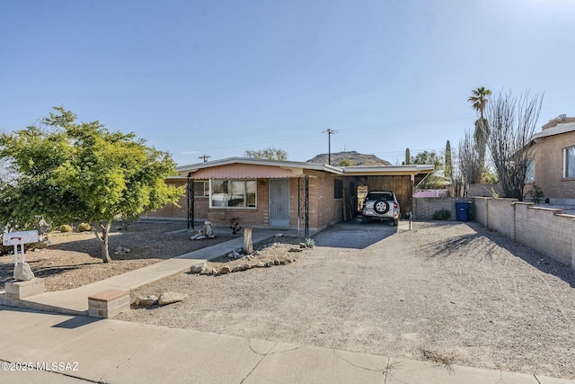 view of front of property featuring a carport