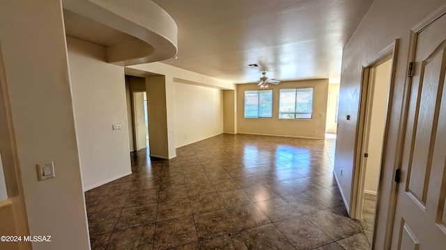 unfurnished room with ceiling fan